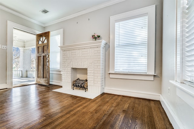 unfurnished living room featuring a fireplace, dark hardwood / wood-style flooring, and ornamental molding