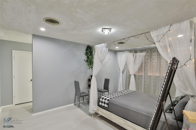 bedroom featuring a textured ceiling