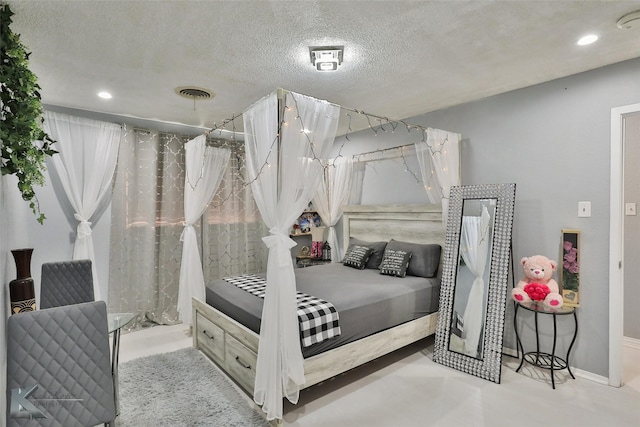 bedroom featuring a textured ceiling