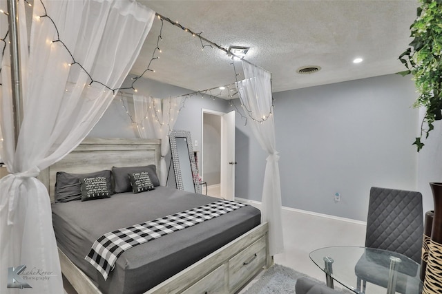 bedroom featuring a textured ceiling