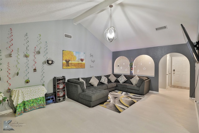 carpeted living room with an inviting chandelier, lofted ceiling with beams, and a textured ceiling