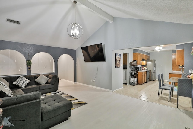 tiled living room with vaulted ceiling with beams, a chandelier, and a textured ceiling