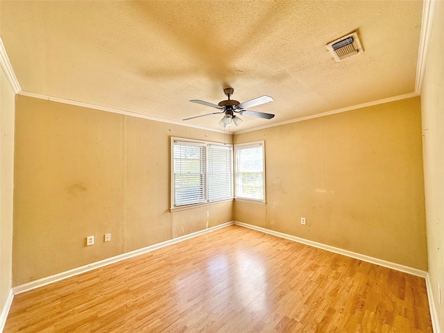 spare room featuring ceiling fan, light hardwood / wood-style flooring, and ornamental molding