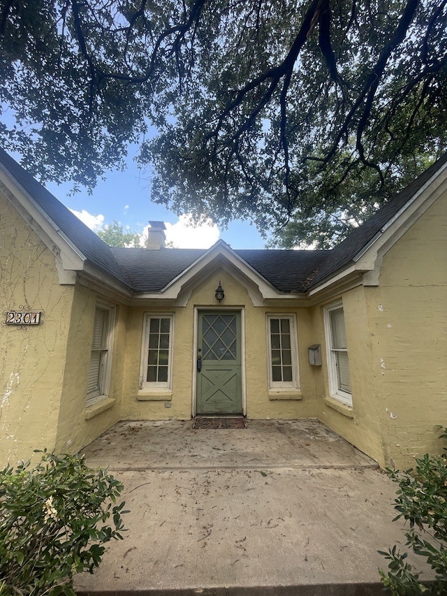 entrance to property with a patio area