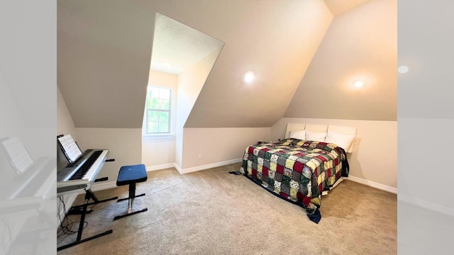 carpeted bedroom with vaulted ceiling