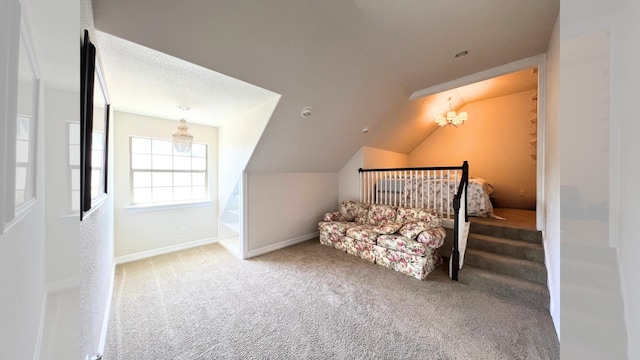 bedroom with carpet flooring, lofted ceiling, and an inviting chandelier