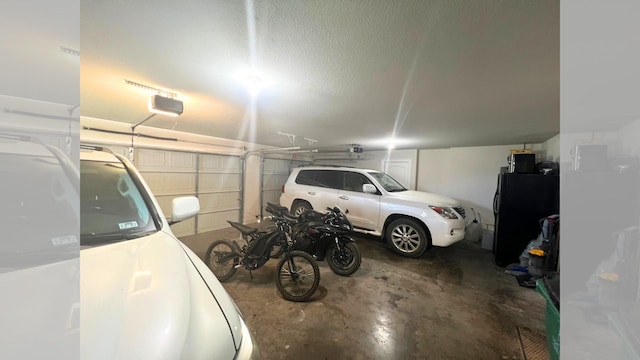 garage featuring black fridge