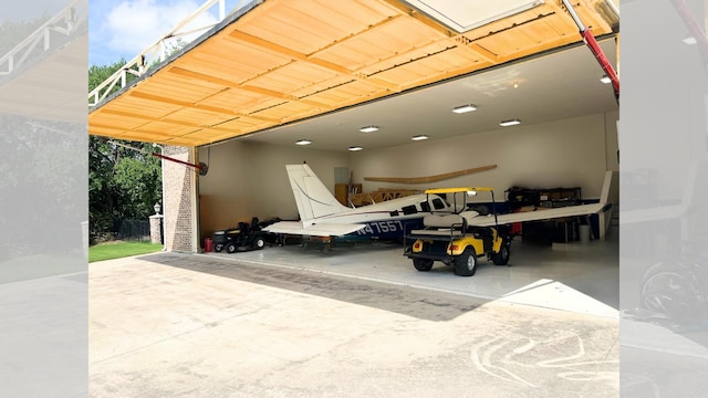 view of parking / parking lot featuring a carport