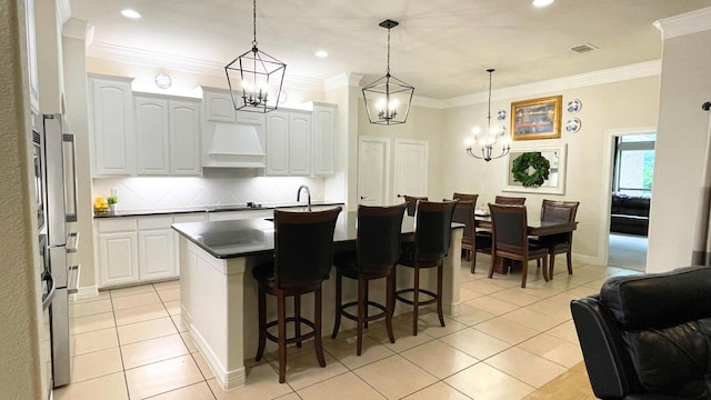 kitchen with crown molding, custom exhaust hood, decorative backsplash, and white cabinets