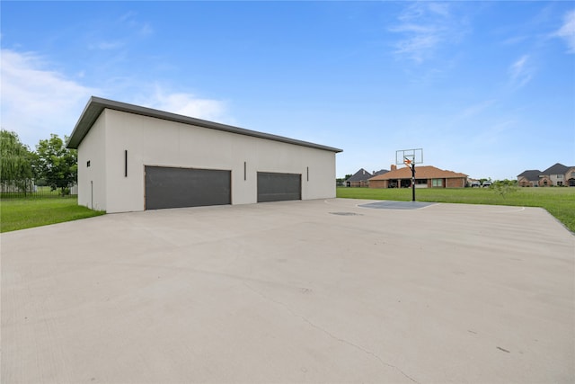 garage with a lawn