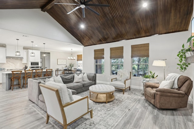 living room with ceiling fan with notable chandelier, high vaulted ceiling, light hardwood / wood-style flooring, wooden ceiling, and beamed ceiling