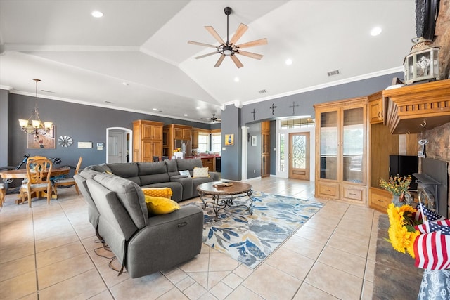 living room featuring light tile patterned floors, visible vents, arched walkways, vaulted ceiling, and ceiling fan with notable chandelier