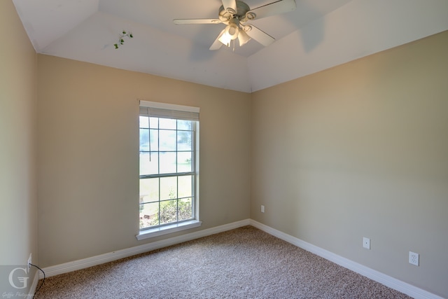 carpeted empty room with ceiling fan and lofted ceiling