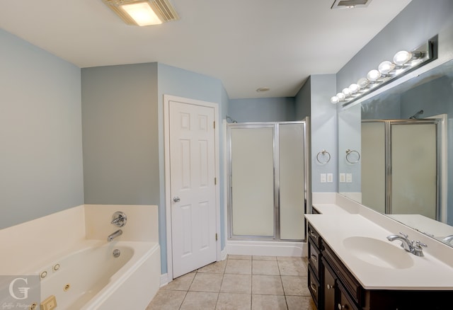 bathroom with tile patterned floors, vanity, and independent shower and bath