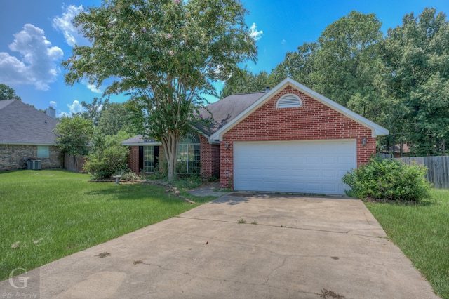 view of front of property with central AC unit, a front yard, and a garage