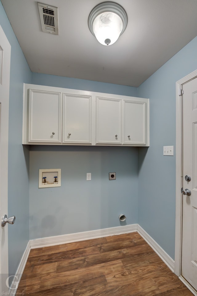 laundry area with hardwood / wood-style flooring, cabinets, washer hookup, and electric dryer hookup