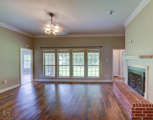 unfurnished living room with ceiling fan, a fireplace, ornamental molding, and hardwood / wood-style flooring