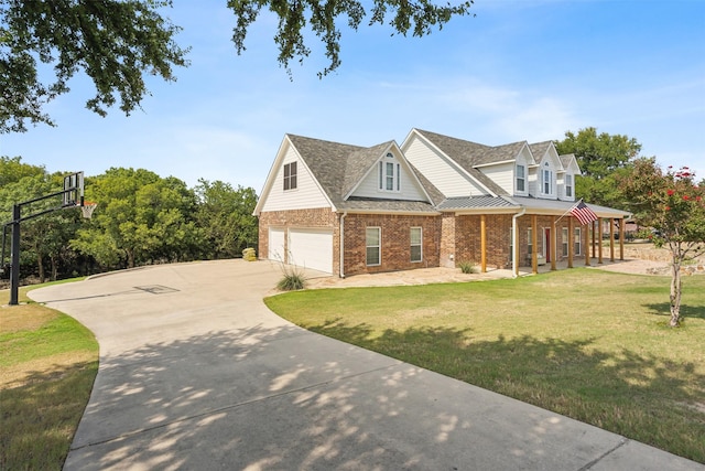 view of front facade featuring a front yard, a porch, and a garage