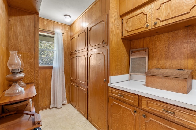 kitchen featuring wooden walls