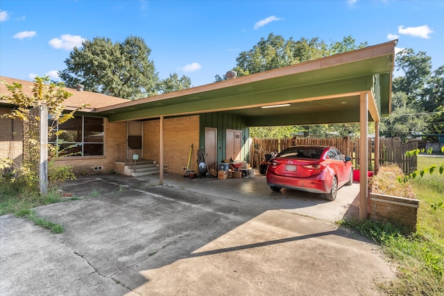 view of vehicle parking with a carport