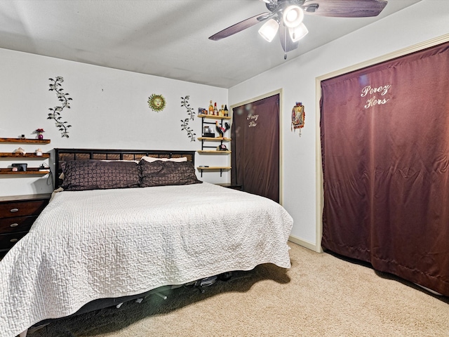 carpeted bedroom featuring ceiling fan