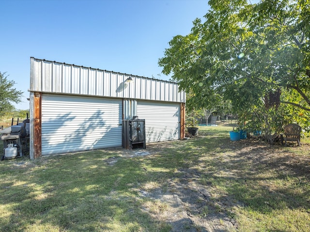 garage with a yard