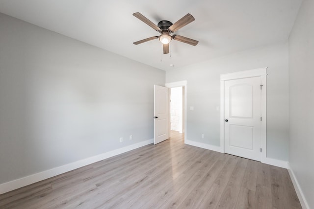 unfurnished bedroom with light wood-style floors, baseboards, and a ceiling fan