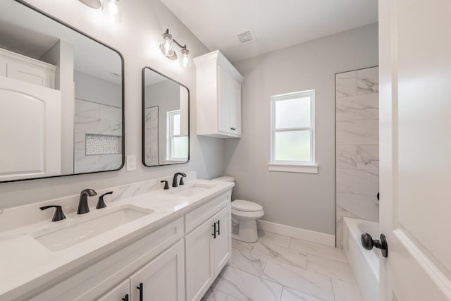 bathroom featuring marble finish floor, a sink, visible vents, and baseboards