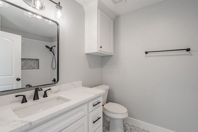 bathroom with vanity, toilet, and tile patterned flooring