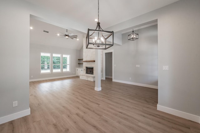 unfurnished living room with a ceiling fan, a fireplace, baseboards, and wood finished floors