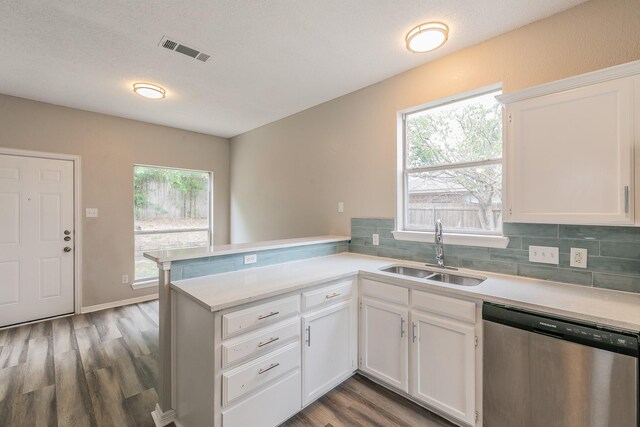 kitchen featuring kitchen peninsula, wood-type flooring, sink, and dishwasher