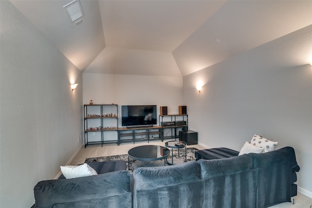 carpeted living room featuring vaulted ceiling