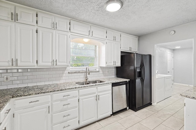 2120 Nottingham Blvd, Fort Worth, TX 76112 - kitchen with sink, white cabinetry, black refrigerator with ice dispenser, dishwasher, and washing machine and dryer