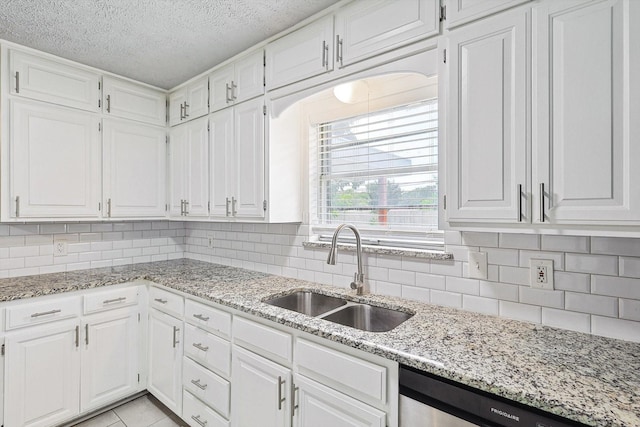2120 Nottingham Blvd, Fort Worth, TX 76112 - kitchen with white cabinetry, sink, and dishwasher