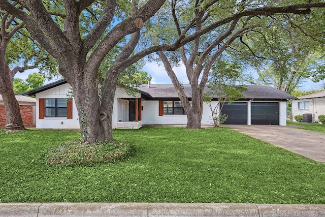 ranch-style house featuring central air condition unit, a front lawn, and a garage