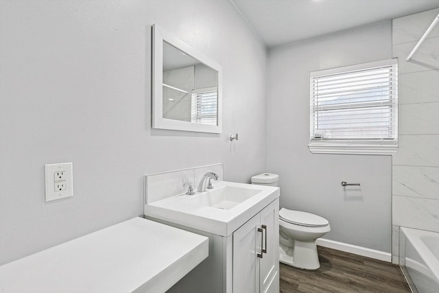 2120 Nottingham Blvd, Fort Worth, TX 76112 - full bathroom featuring washtub / shower combination, vanity, toilet, and hardwood / wood-style floors