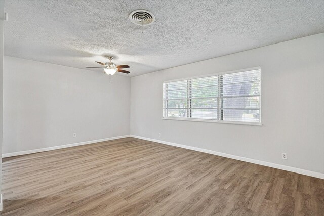 2120 Nottingham Blvd, Fort Worth, TX 76112 - spare room with a textured ceiling, ceiling fan, and light hardwood / wood-style flooring