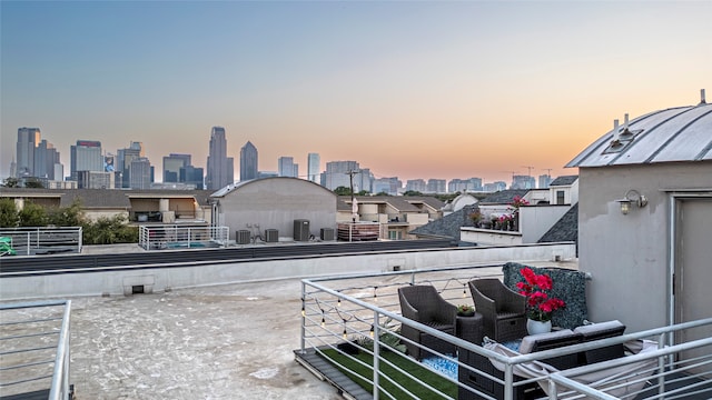 patio terrace at dusk with a balcony