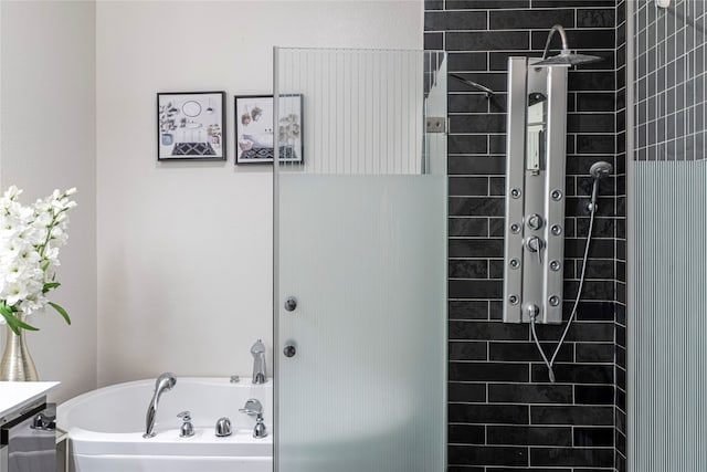 bathroom with a bathtub and vanity