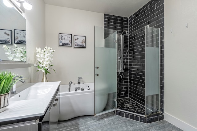 bathroom featuring shower with separate bathtub and vanity