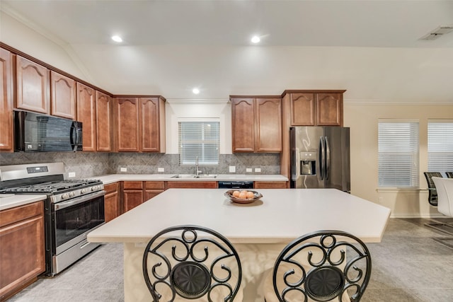 kitchen featuring crown molding, sink, decorative backsplash, and black appliances