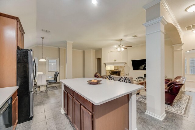 kitchen featuring ceiling fan, pendant lighting, refrigerator, and ornate columns