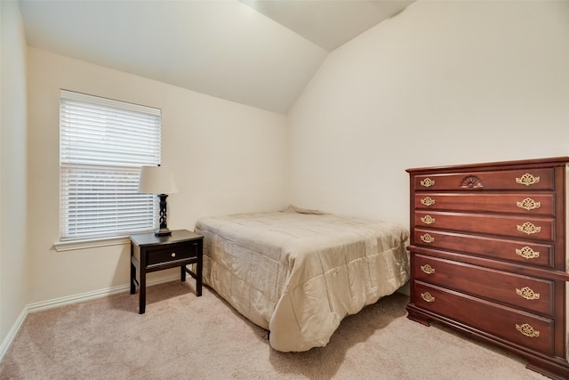 carpeted bedroom featuring vaulted ceiling