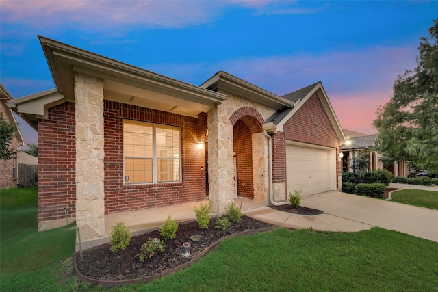 ranch-style home featuring a yard and a garage