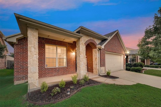 single story home featuring a garage and a lawn