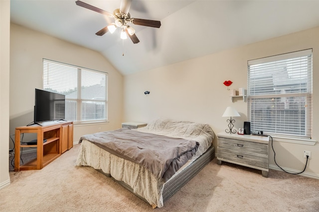 carpeted bedroom featuring vaulted ceiling and ceiling fan