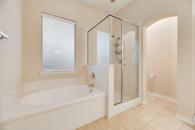 bathroom with separate shower and tub and tile patterned floors