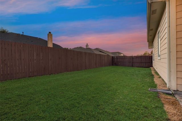 view of yard at dusk