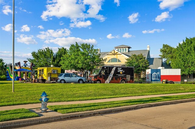 view of community featuring a lawn