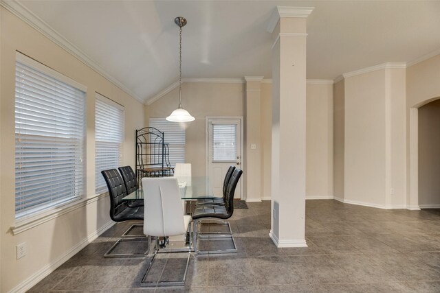 dining space with tile patterned floors, lofted ceiling, ornamental molding, and ornate columns